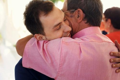 Two men hugging