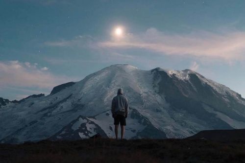 Man staring at mountain