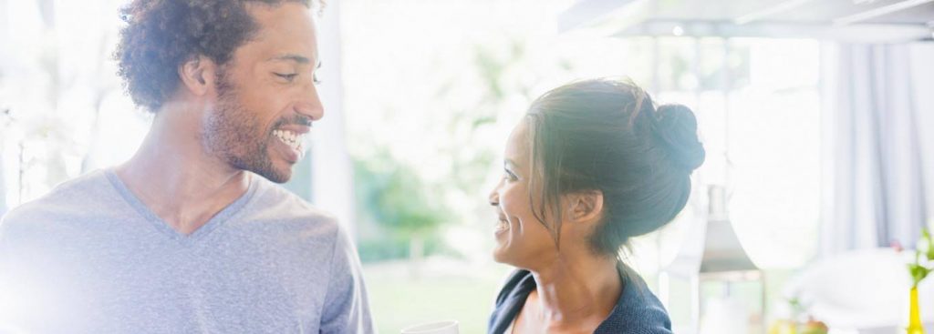 couple happily smiles looking at each other