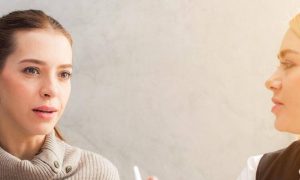 two women talking looking at each other