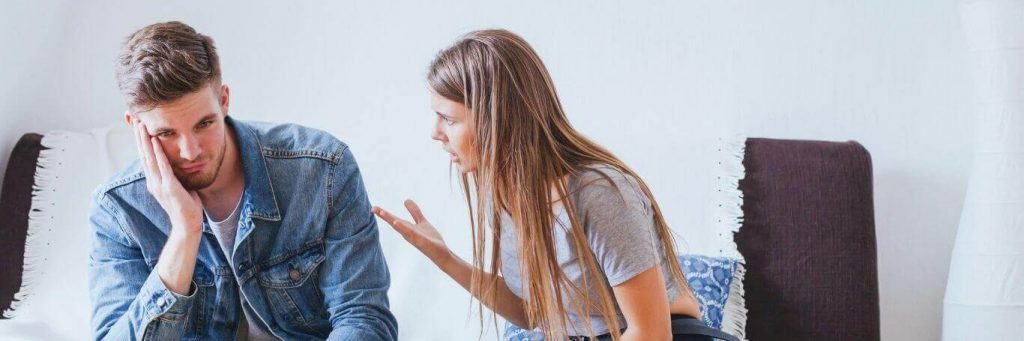 couple having conflict arguing in living room