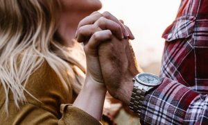 couple holds hands