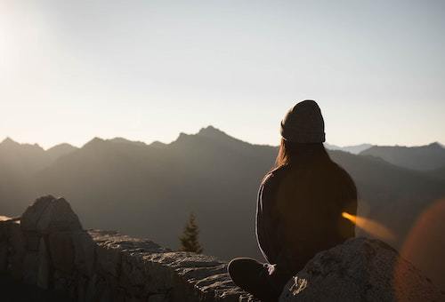A woman looking at mountains