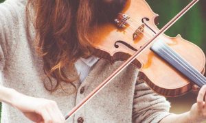 woman plays violin