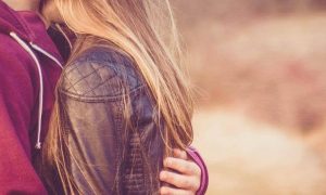 couple hugging kissing