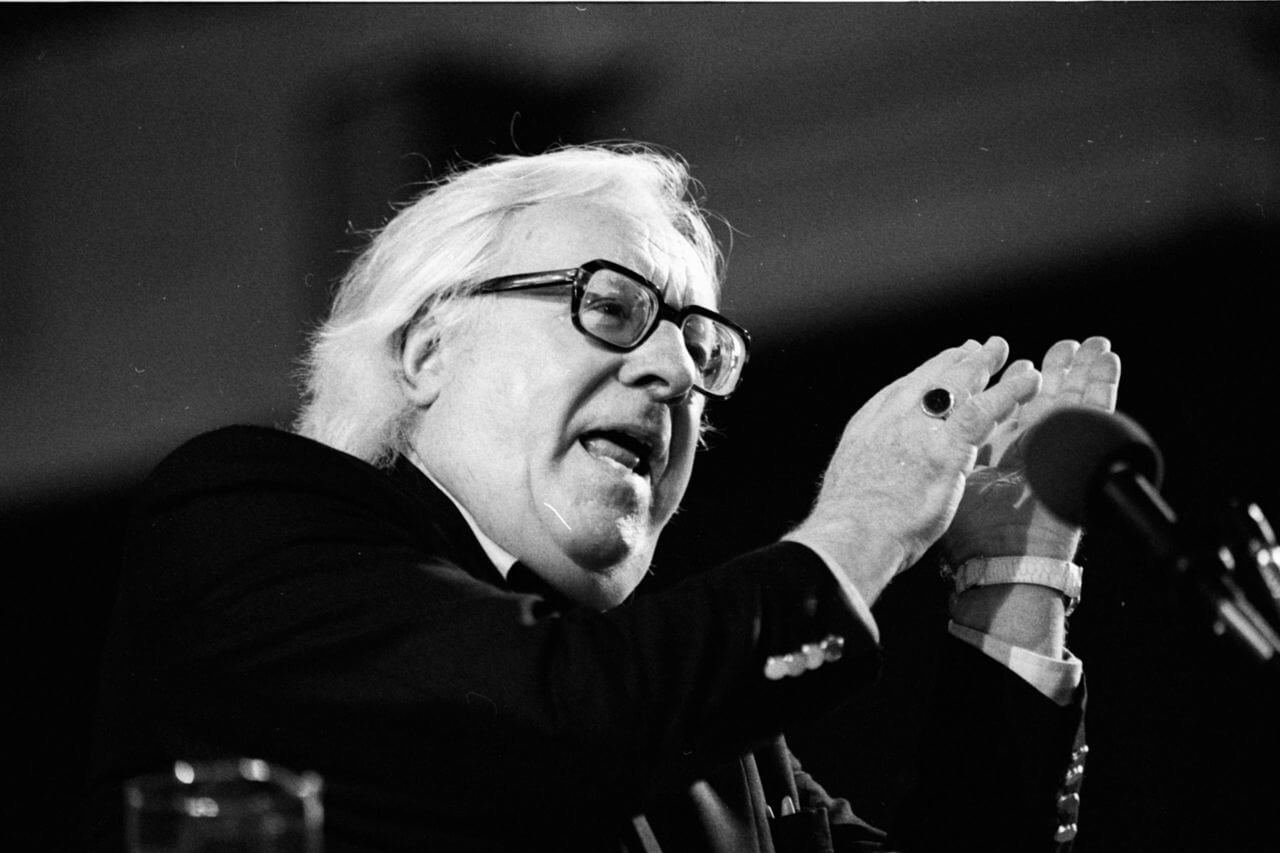 American author Ray Bradbury stands in front of a microphone at the 1990 Miami Book Fair International.