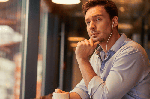 Man reflecting in the early morning while drinking coffee hoping to achieve ind Mastery