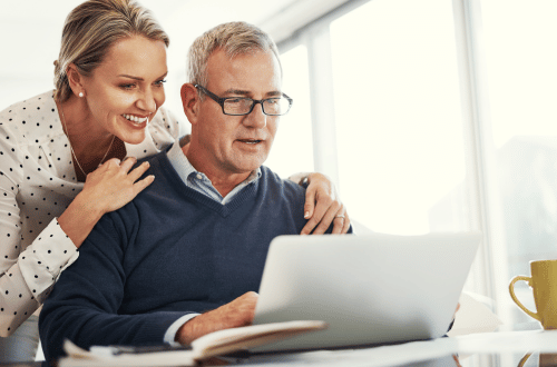 Two people looking at a computer