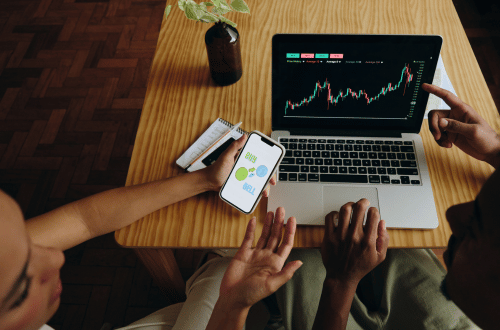 two people looking at investments rising on a computer for Successful Retirement Planning
